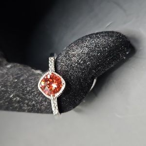 F-8 Silvertone ring with red stones and clear accents